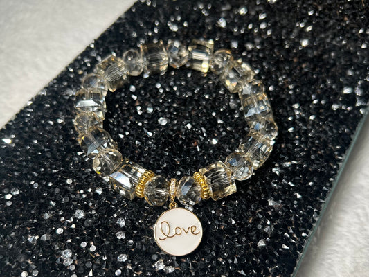 Crystal Bracelet with White Enamel Gold Love Charm