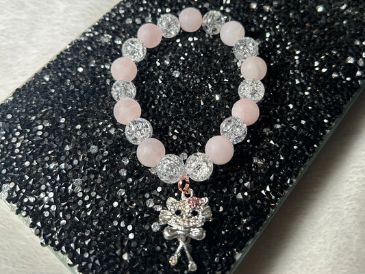 Matte Rose Quartz and Glass Bead Bracelet is adorned with Hello Kitty-inspired charm
